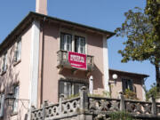 A poster hanging from a balcony reads &ldquo;Sintra: A traffic jam in paradise&rdquo;, in Sintra, Portugal, Friday, Aug. 9, 2024.