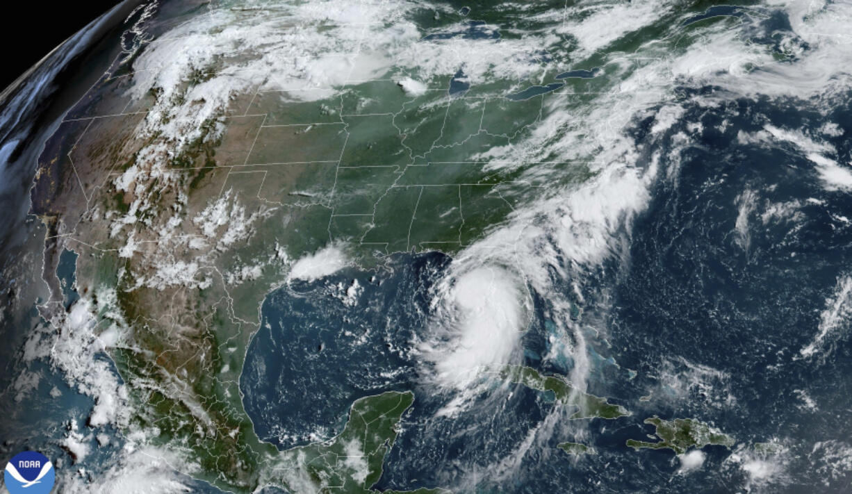 This satellite image provided by NOAA shows Tropical Storm Debby as it moves through the Gulf of Mexico toward Florida on Sunday, Aug. 4, 2024.