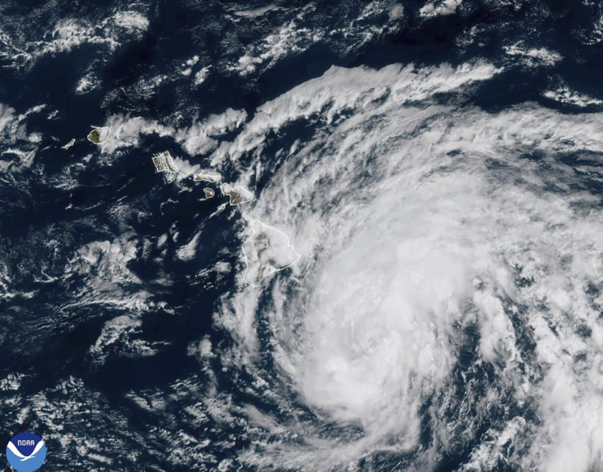 This image provided by the National Oceanic and Atmospheric Administration shows Tropical Storm Hone as it continues to track to the west toward the Hawaiian Islands, Saturday, Aug. 24, 2024.