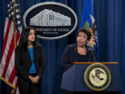 FILE - Attorney General Loretta Lynch, joined by Principal Deputy Assistant Attorney General Vanita Gupta speaks during a news conference at the Justice Department in Washington, Wednesday, Feb. 10, 2016, about Ferguson, Mo. The federal government sued Ferguson on Wednesday, one day after the city council voted to revise an agreement aimed at improving the way police and courts treat poor people and minorities in the St. Louis suburb.