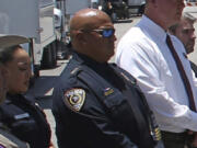 FILE - Uvalde School Police Chief Pete Arredondo, third from left, stands during a news conference outside of the Robb Elementary school on May 26, 2022, in Uvalde, Texas.