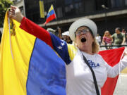 Opposition supporters protest the reelection of President Nicol&aacute;s Maduro one month after the disputed vote, which opposition leaders claim they won by a landslide, in Caracas, Venezuela, Wednesday, Aug. 28, 2024.