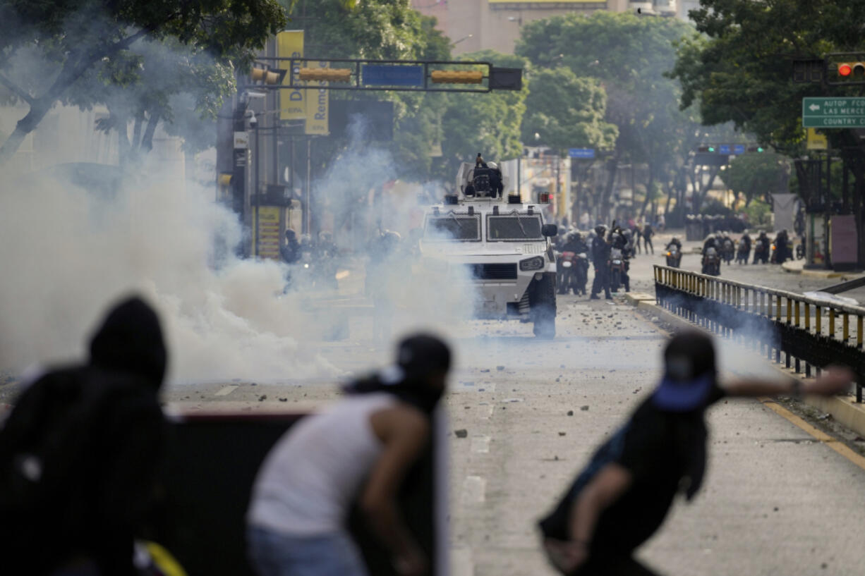 Protesters clash with police during demonstrations against the official election results declaring President Nicolas Maduro&#039;s reelection, the day after the vote in Caracas, Venezuela, Monday, July 29, 2024.