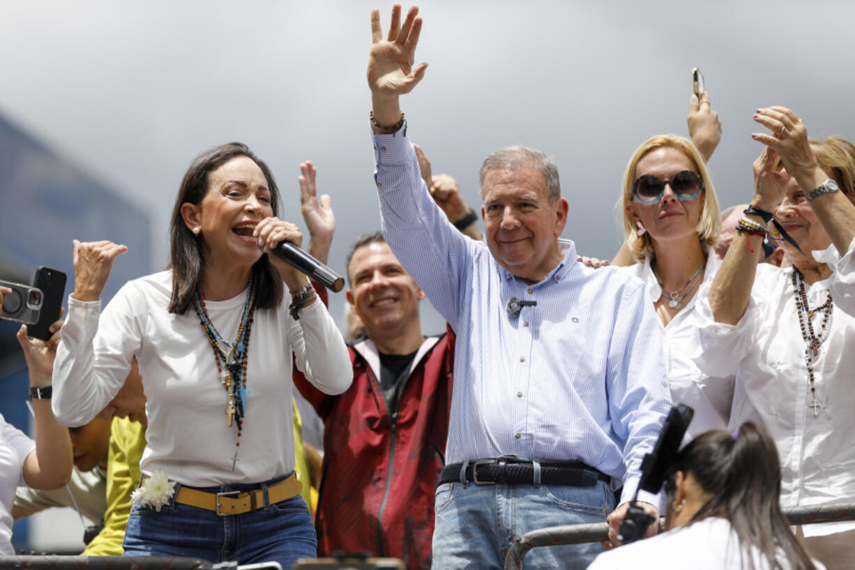 Opposition leader Maria Corina Machado, left, and opposition presidential candidate Edmundo Gonzalez address supporters from the top of a truck during a protest against the official presidential election results declaring President Nicolas Maduro the winner in Caracas, Venezuela, on Tuesday, July 30, 2024, two days after the vote.