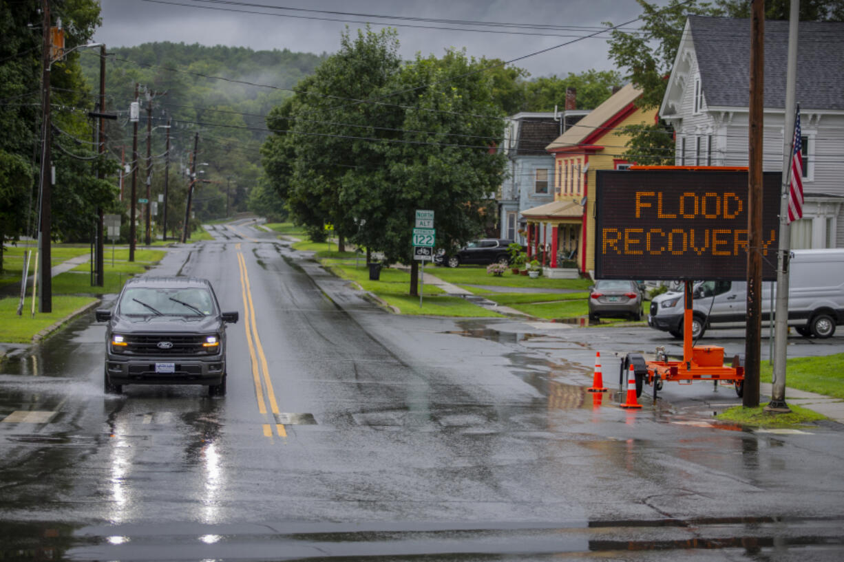 Water floods a roadway amid storms in Lyndon, Vt., Wednesday, July 31, 2024.