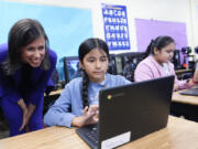 Jessica Rosenworcel, Chairwoman of the Federal Communications Commission, talks to a student in a STEM lab during a visit to Union Avenue Elementary, Tuesday, Aug. 13, 2024, in Los Angeles.