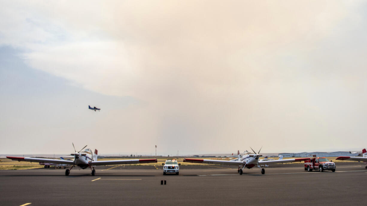 A plane carrying the ashes of James Maxwell, a pilot who died fighting a fire in Ore., flies into the Lewiston Nez Perce County Airport, on Friday, Aug. 2, 2024, in Lewiston, Idaho.