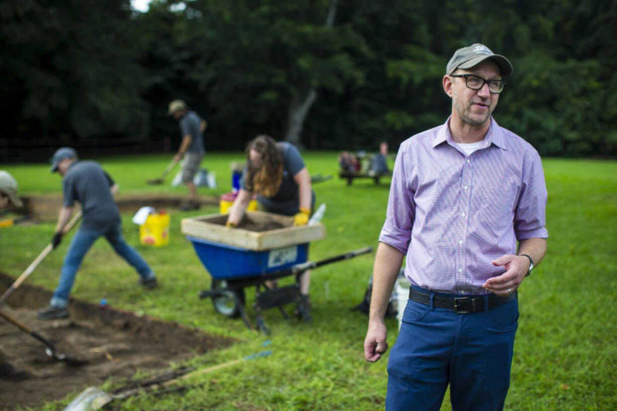 Jack Gary, Colonial Williamsburg&rsquo;s executive director of archaeology, speaks July 31 at the excavation site of an 18th century ornamental garden in Williamsburg, Va.