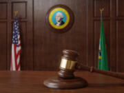 Courtroom scene with US flag and state seal and flag of the state of Washington.