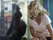 This image released by HBO shows Tonia Haddix with a chimpanzee named Tonka in a scene from &ldquo;Chimp Crazy.&rdquo; (HBO via AP)