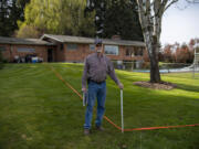 Dean Hergesheimer, outside his Fairgrounds neighborhood home in April 2022, and his neighbors have been battling the county&rsquo;s decision not to improve their road despite new homes added to the area.