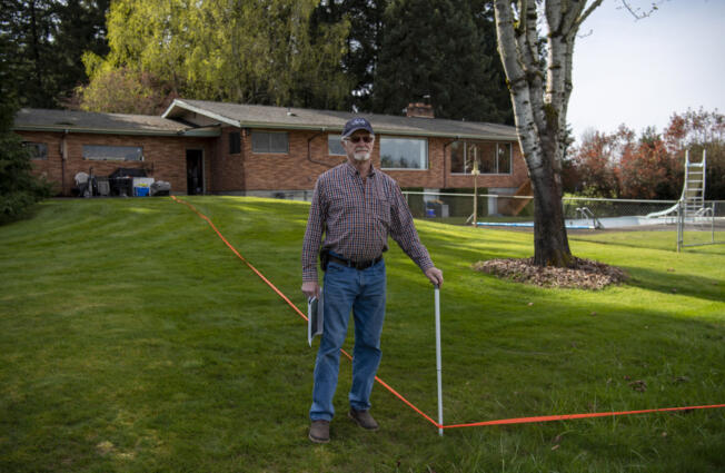 Dean Hergesheimer, outside his Fairgrounds neighborhood home in April 2022, and his neighbors have been battling the county&rsquo;s decision not to improve their road despite new homes added to the area.