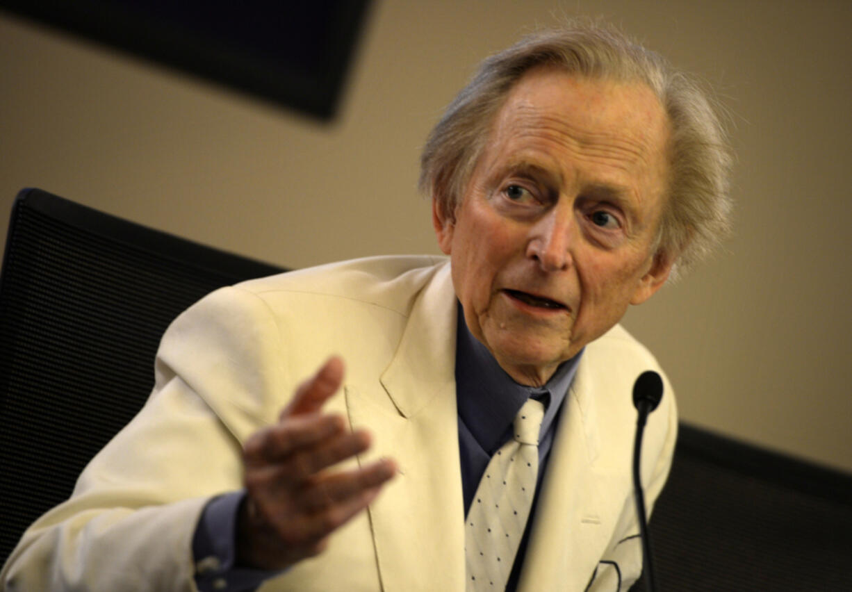 Writer and journalist Tom Wolfe gestures Dec. 10, 2013, during the presentation of his book &ldquo;Bloody Miami&rdquo; at La Pedrera building in Barcelona.