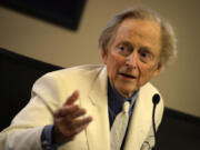 Writer and journalist Tom Wolfe gestures Dec. 10, 2013, during the presentation of his book &ldquo;Bloody Miami&rdquo; at La Pedrera building in Barcelona.