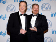 Producer John Wells, right, and writer Michael Crichton pose in the press room Jan. 22, 2005, at the 16th Annual Producers Guild Awards at Culver Studios in Culver City, Calif.