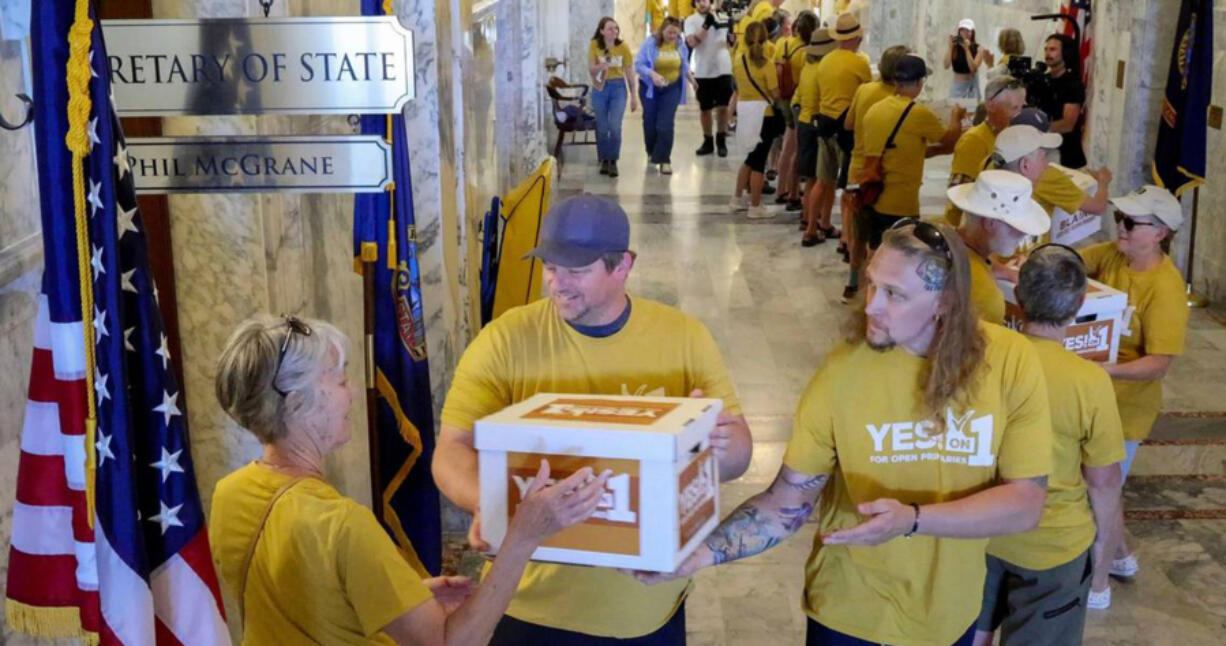 Idahoans for Open Primaries, a coalition backing an initiative to create an open primary and ranked choice voting in Idaho, deliver boxes from every county filled with signatures to deliver to the Idaho Secretary of State&rsquo;s Office in July.