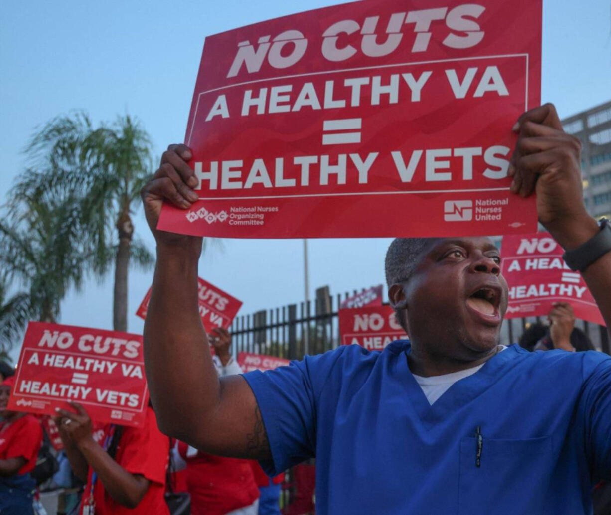 Shardrick Ridley, 49-year-old nurse, participates in a protest advocating for increased investment in the VA healthcare system, opposing job freezes and cuts that jeopardize veterans&iacute; access to medical care.