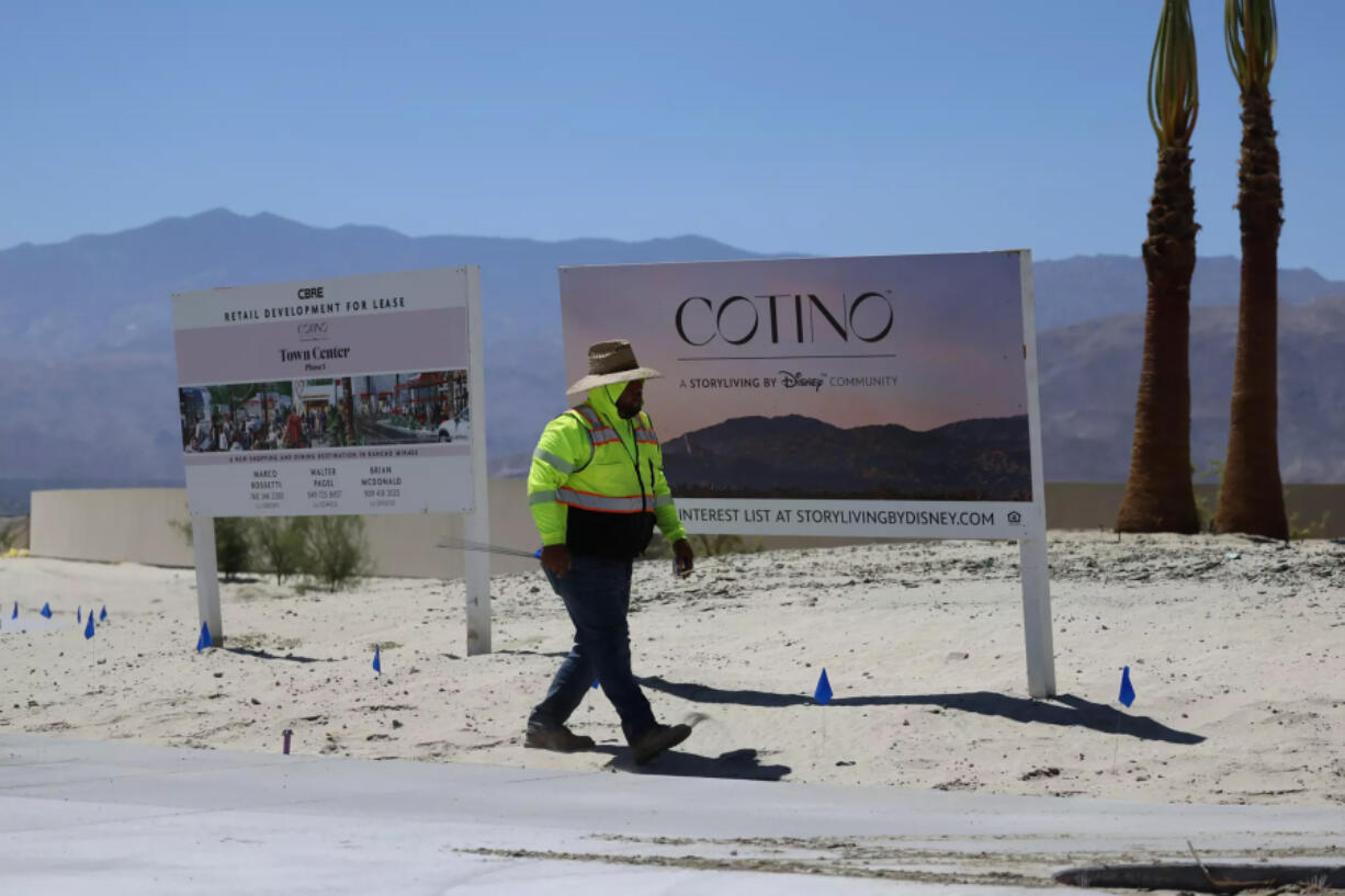 Construction is progressing at Cotino, a Disney housing project with 1,932 planned homes spread across more than 600 acres in the desert city. (Allen J.