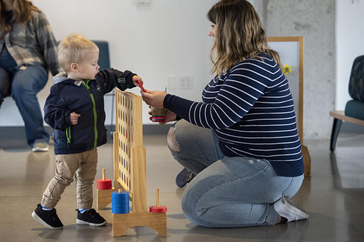 Avery Nearents, 18 months old of Vancouver, left, gets some one-on-one playtime with his mom, Hailey, at a 2023 Columbia Play Project session at Fourth Plain Commons Community Center.