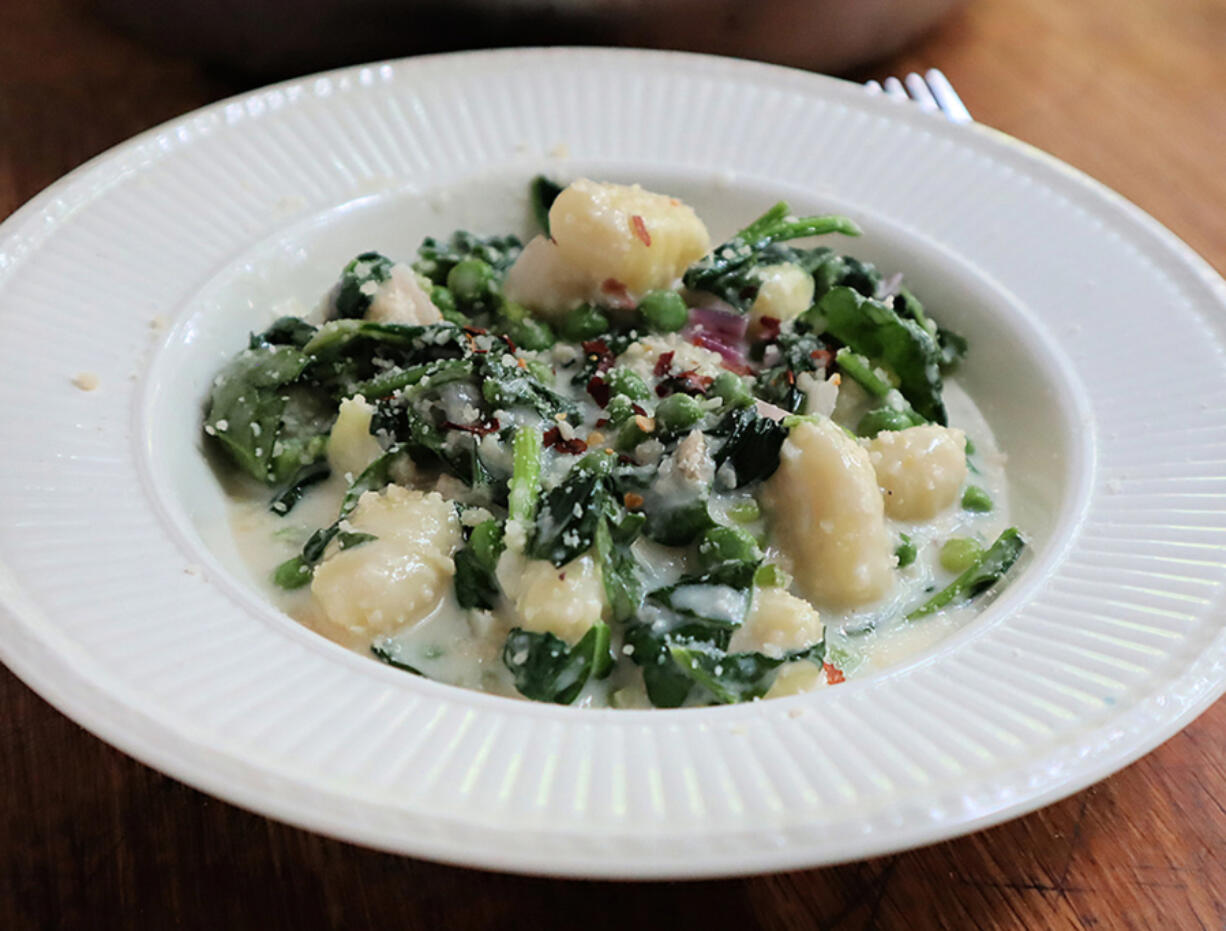 You won&rsquo;t miss the wheat in this gluten-free gnocchi tossed with spinach and peas in a lemony cream sauce.