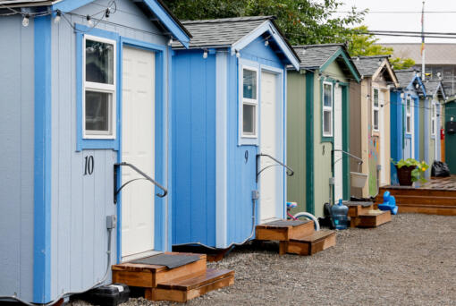 A row of brightly painted tiny houses at Henderson Village, Monday, July 29, 2024, in the Rainier Beach neighborhood of Seattle.