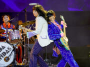 Mila de la Garza, from left, Lucia de la Garza and Eloise Wong of the Linda Lindas open for the Rolling Stones on July 13 at SoFi Stadium in Inglewood, Calif.