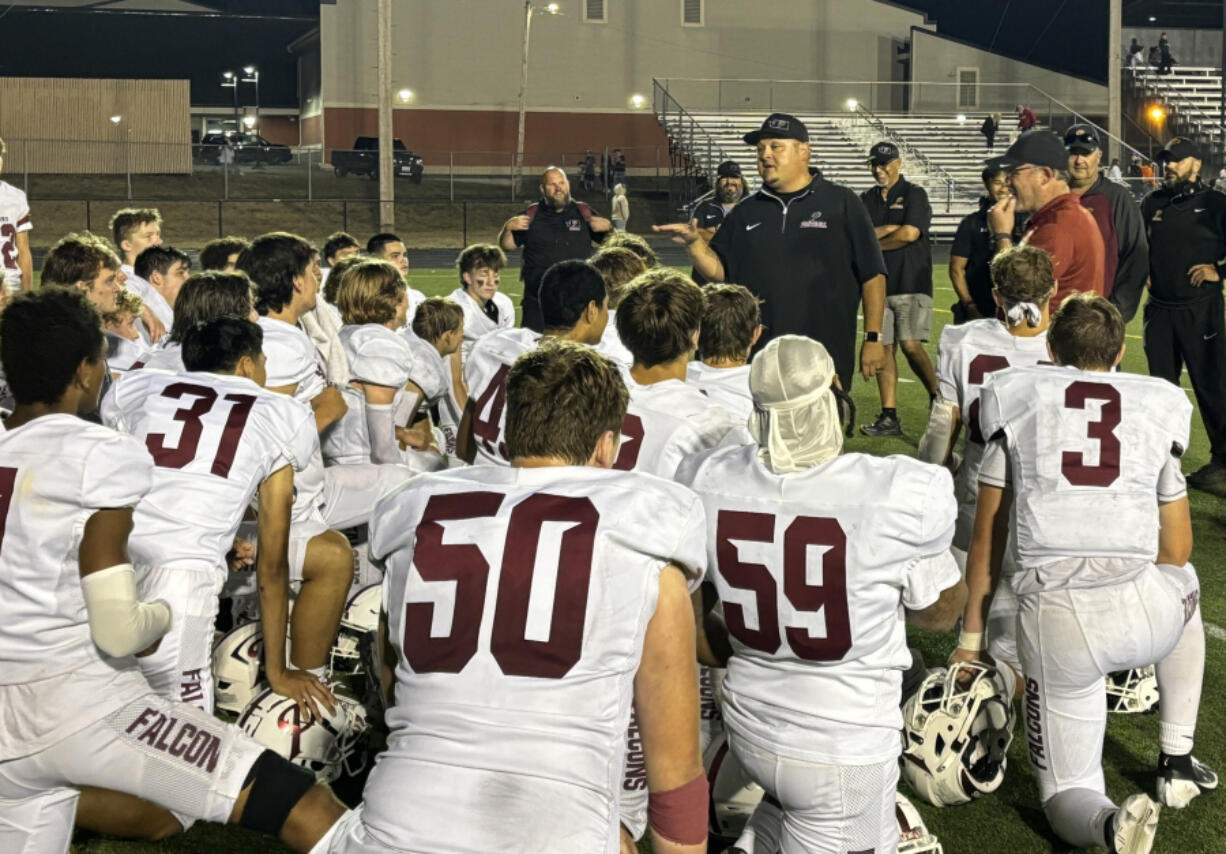 Prairie head football coach Junior Miller addresses his team after a 21-16 win over Washougal at Fishback Stadium in Washougal on Friday, Sept. 13, 2024.