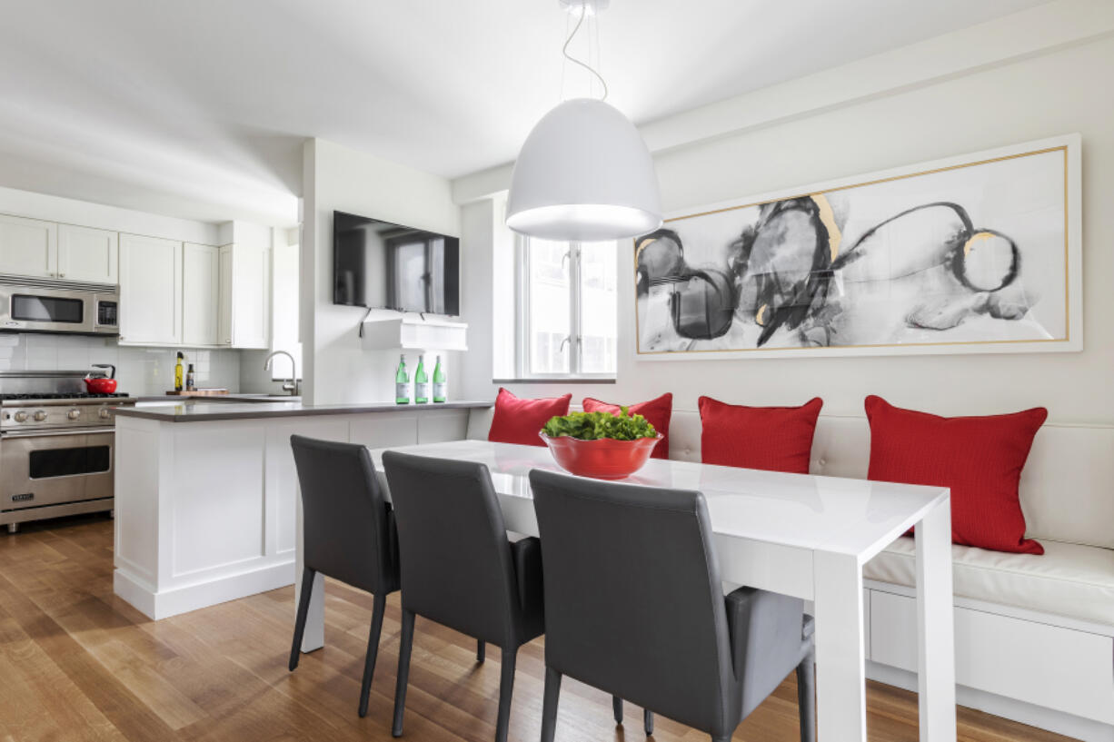 Ruby red accents sprinkled throughout this kitchen adds a vibrant sense of color.