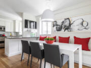 Ruby red accents sprinkled throughout this kitchen adds a vibrant sense of color.