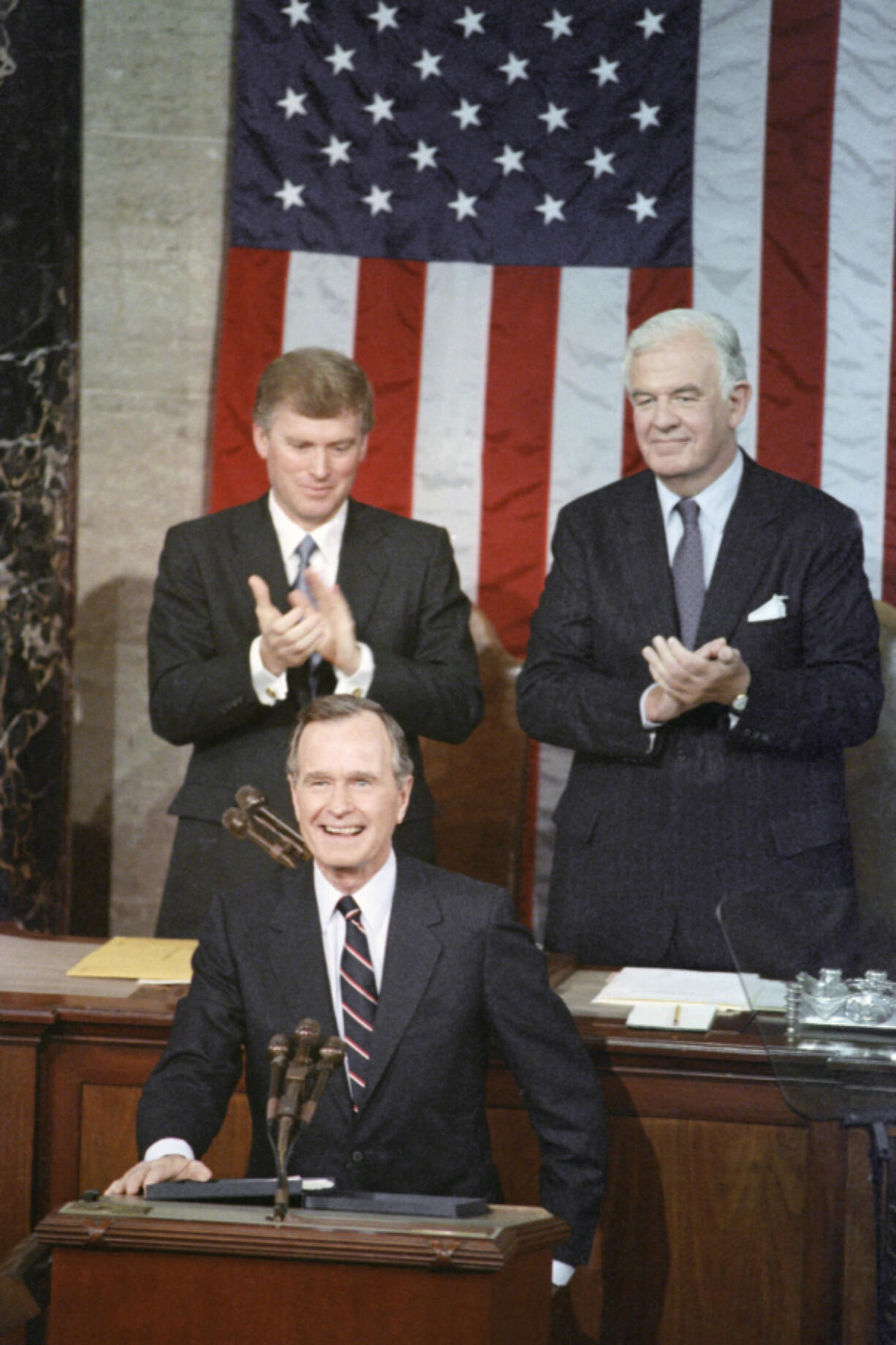 President George Bush receives applause from Vice President Dan Quayle, left, and House Speaker Thomas Foley prior to delivering his first State of the Union address Jan. 31, 1990 on Capitol Hill in Washington.