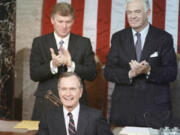 President George Bush receives applause from Vice President Dan Quayle, left, and House Speaker Thomas Foley prior to delivering his first State of the Union address Jan. 31, 1990 on Capitol Hill in Washington.