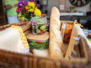 A the interior of a picnic basket is seen as it sits on display inside EZPZ Gatherings in Aspinwall on Monday, Aug. 5, 2024. The picnic basket was put together by owner Sarah Tuthill who recently published the cookbook &ldquo;Gathering Boards,&rdquo; which instructs people how to compose various picnic boards.