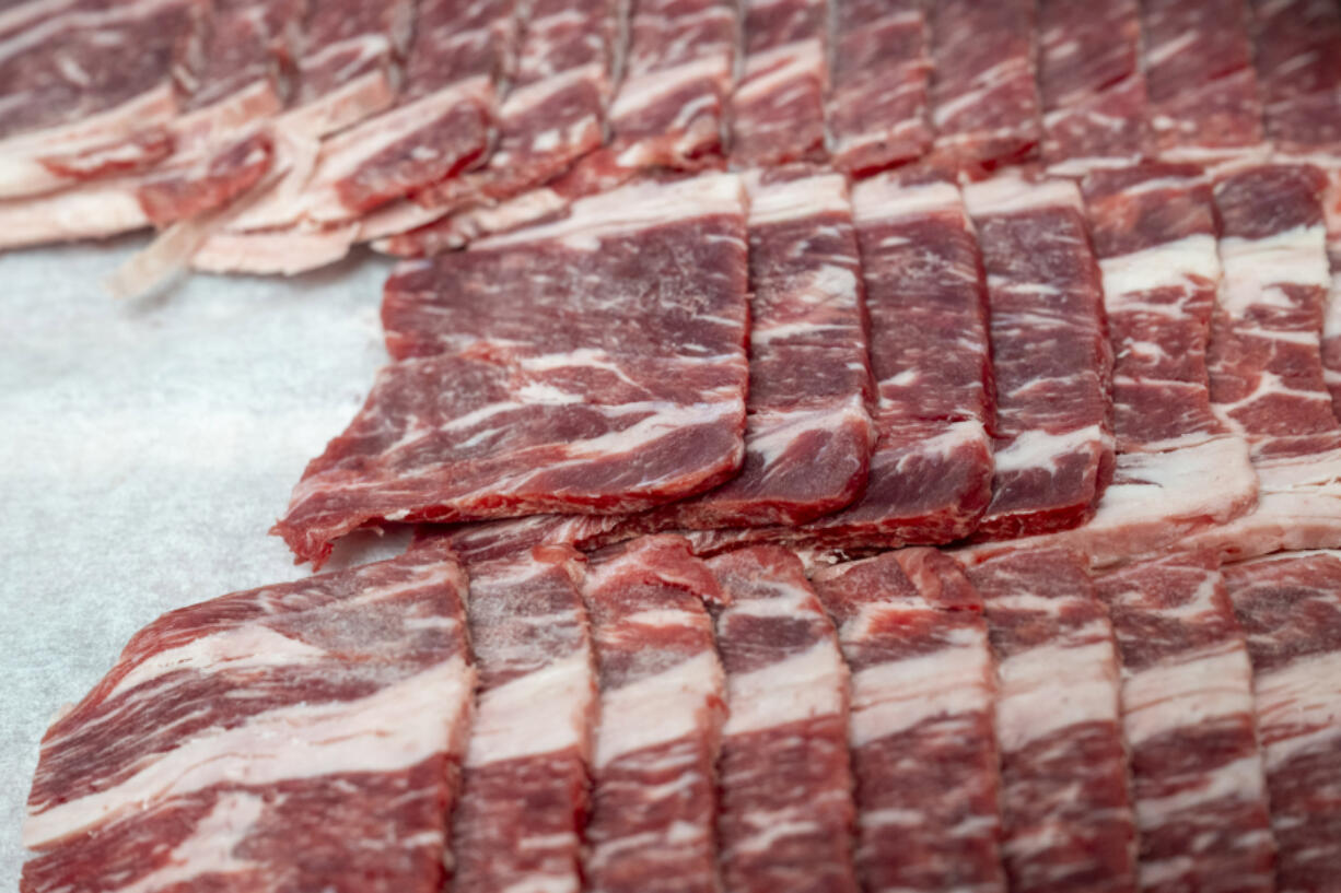 Meat lays in the kitchen of Cobra on Wednesday, Aug. 14, 2024, in Bloomfield. (Benjamin B.