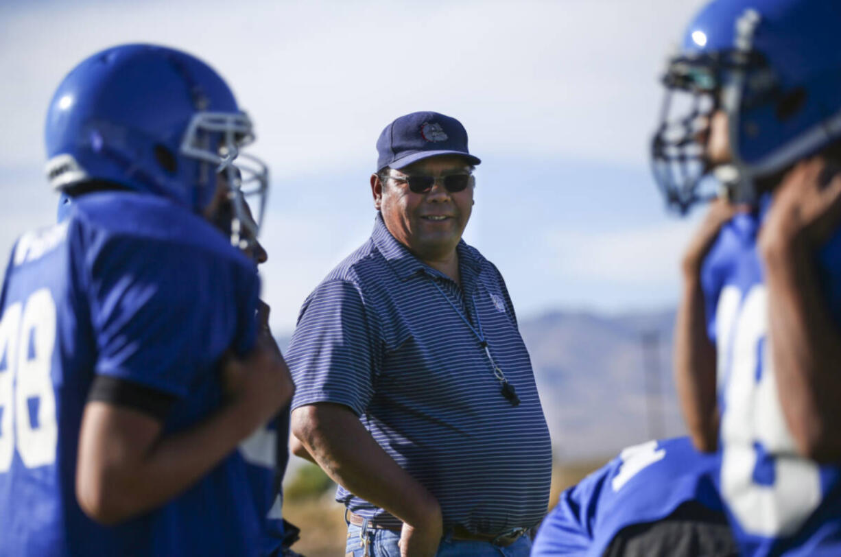 Football coach Richard Egan leads practice Sept. 25, 2018, at McDermitt High School in McDermitt, Nev.