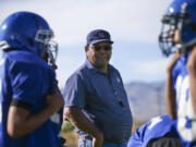 Football coach Richard Egan leads practice Sept. 25, 2018, at McDermitt High School in McDermitt, Nev.