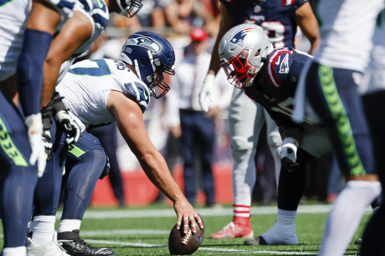 Seattle Seahawks center Connor Williams (57) prepares to hike the ball at the line of scrimmage during the first half of an NFL football game against the New England Patriots on Sunday, Sept. 15, 2024, in Foxborough, Mass. (AP Photo/Greg M.