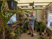 Roots, Shoots and Leaves owner Marc Eaton stands July 14 in the back of his truck during the St. Paul Food Truck Festival at Union Depot Lot C in St. Paul, Minn.