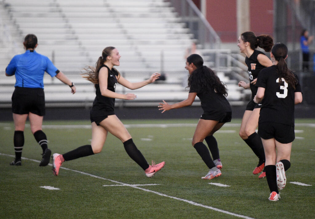 Washougal's Maite Urzua-Sanchez, center, celebrates with teammate Maddy Alldrin, left, after scoring a goal in a second half of a 2A Greater St. Helens League girls soccer game against Hockinson on Tuesday, Sept. 24, 2024, at Washougal High School.