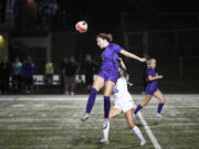 Columbia River's Raya Janson (24) heads the ball away from Ridgefield's Tori Lasch (15) during a 2A GSHL girls soccer game on Thursday, Sept. 26, 2024, at Columbia River High School.