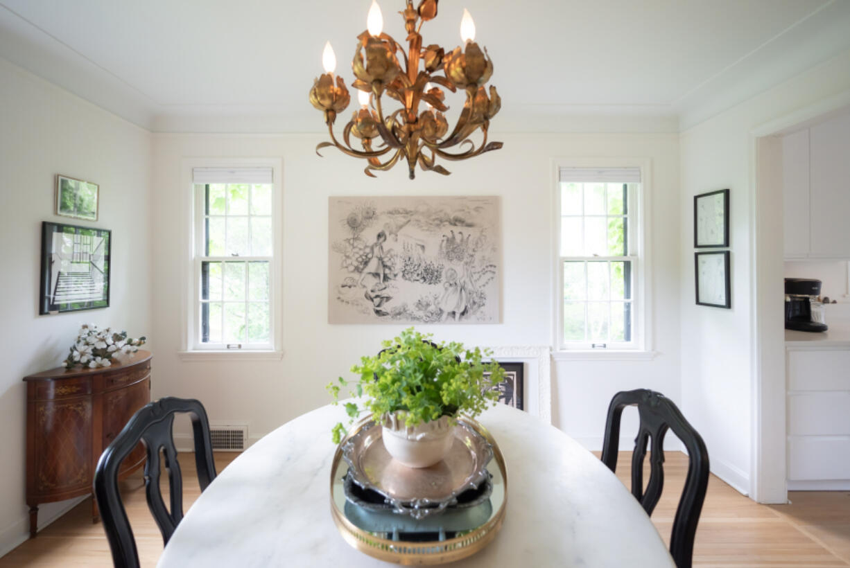 The dining room features a drawing of Howie&rsquo;s two daughters Nora and Annie in their garden, by local artist Lisa Rydin Erickson.