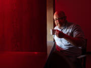 Bill Ristenpart, director of the University of California Davis&rsquo; new Coffee Center, pauses under the red lights of the facility&rsquo;s sensory booth July 24 in Davis, Calif.