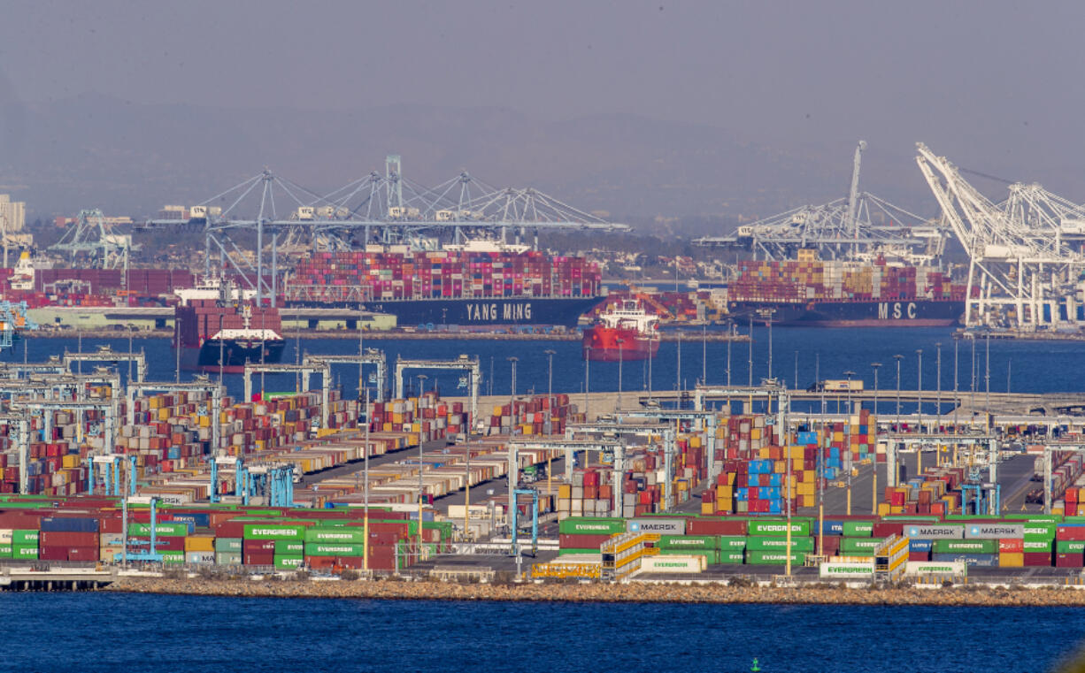 Dozoens of container ships sit off the coast of the Ports of Los Angeles and Long Beach, waiting to be unloaded, Oct. 13, 2021. Port officials say they&Ccedil;&fnof;&Ugrave;re better equipped to handle a surge of cargo if dock workers strike in the East Coast. (Allen J.