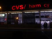 People walk into a CVS Pharmacy on Friday, Aug. 30, 2024, in Inglewood, California. Workers at the CVS specialty pharmacy in Redlands have filed a petition with the National Labor Relations Board seeking to hold a union election.