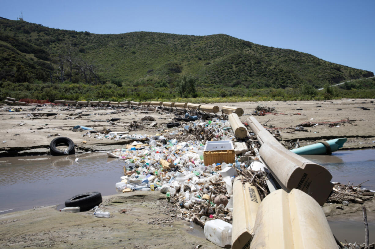 Sewage water filled with trash flows down the Tijuana River on  April 9, 2024, in Imperial Beach, California.