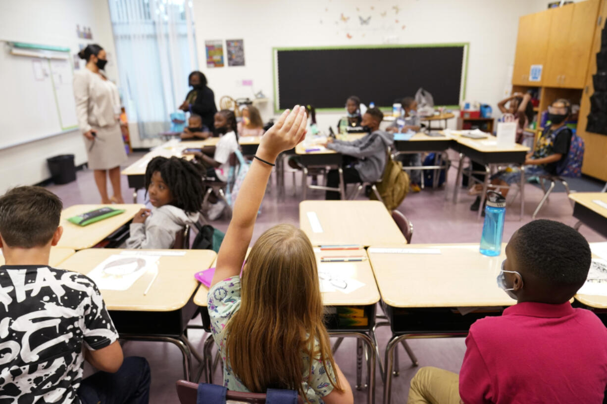 FILE - A student raises their hand in a classroom at Tussahaw Elementary school Aug. 4, 2021, in McDonough, Ga. According to test results released by the Georgia Department of Education on Friday, July 26, 2024, Georgia students in some grades approached pre-pandemic scores in the 2023-2024 school year, while other grades did not.