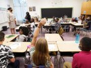 FILE - A student raises their hand in a classroom at Tussahaw Elementary school Aug. 4, 2021, in McDonough, Ga. According to test results released by the Georgia Department of Education on Friday, July 26, 2024, Georgia students in some grades approached pre-pandemic scores in the 2023-2024 school year, while other grades did not.