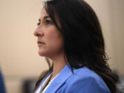 Vancouver Police Officer Andrea Mendoza watches her body cam footage April 22 at the Clark County Courthouse. Mendoza was charged with misdemeanor fourth-degree assault after threatening to use a Taser on the genitals of a suspected shoplifter in May 2023. A Clark County District Court jury acquitted her.