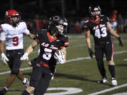 Camas’ Chase McGee turns up field for an eventual 50-yard touchdown reception as the first half clock expired in Friday’s non-league football game against Oregon City. Camas won 48-14 behind McGee’s three touchdown receptions.