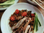 These caramelized, pan-fried pork chops are made in the same cast-iron pan as the fried rice.