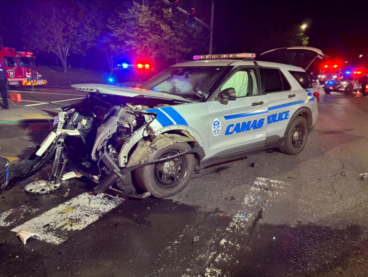 A patrol vehicle driven by Camas police Officer Casey Handley was extensively damaged in a two-car crash Sunday evening.